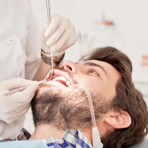 Our professional dental hygienist is providing a gentle teeth cleaning service for a patient in Maabila.